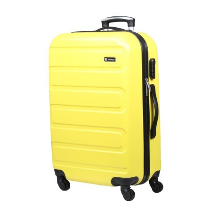 żółta walizka na kółkach